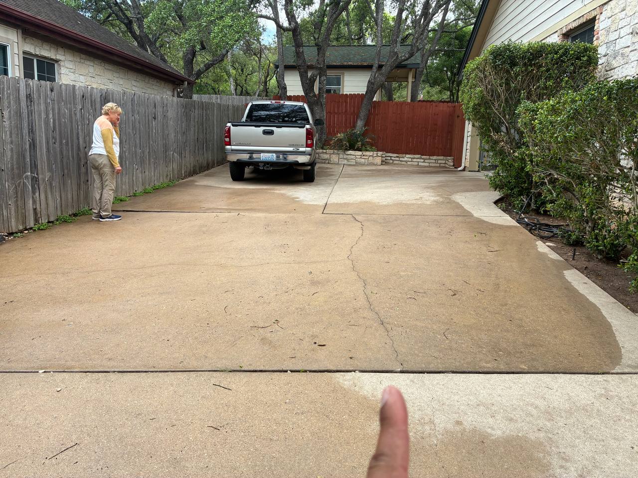 Residential driveway crack with visible context and scale used as a foundation repair hero image for Cibolo, Texas