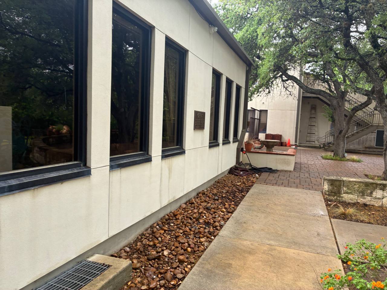 Custom home exterior walkway and drainage area used as a Shavano Park foundation repair hero image